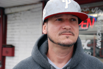 Marcus Tito Santos has been tinting windows at his brother’s Harrisburg car shop, Above Da Rim, since his release from prison. While serving his sentence at SCI-Fayette, he said he believes that pollution from the adjacent coal ash site caused him to develop rashes, heartburn and severe swelling of multiple body parts. Photo: by Natasha Khan