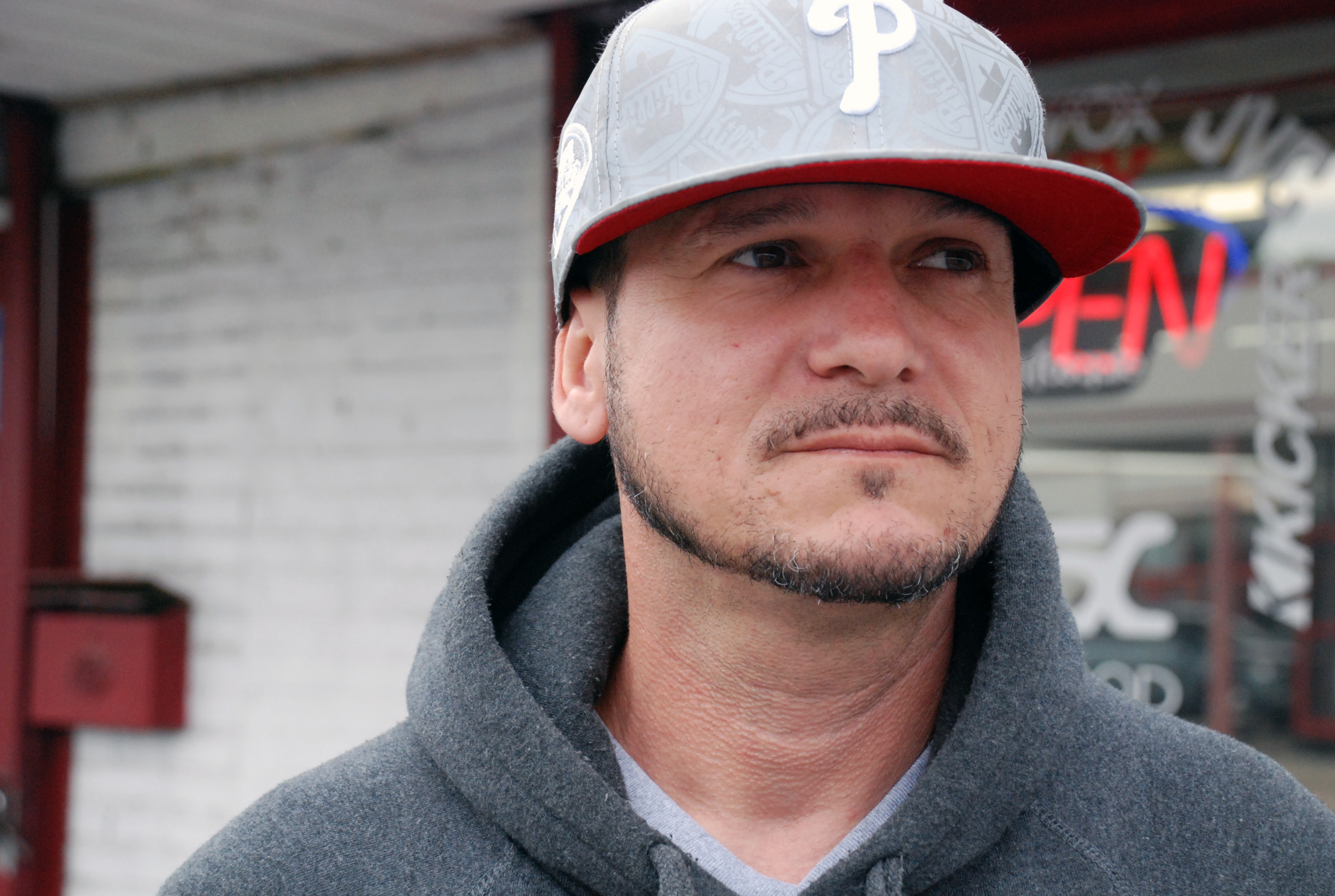 Marcus Tito Santos has been tinting windows at his brother’s Harrisburg car shop, Above Da Rim, since his release from prison. While serving his sentence at SCI-Fayette, he said he believes that pollution from the adjacent coal ash site caused him to develop rashes, heartburn and severe swelling of multiple body parts. Photo: by Natasha Khan