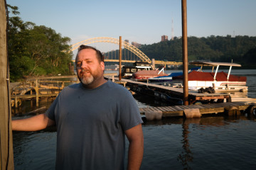Jason Fleming has found his oasis: Living in a trailer on the Ohio River, care-taking a mom-and-pop marina. Photo: Lou Blouin