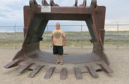 Miner Kent Parrish stands in a coal shovel at a roadside viewing platform for the Eagle Butte coal mine outside of Gillette, Wyoming. Photo: Leigh Paterson / Inside Energy