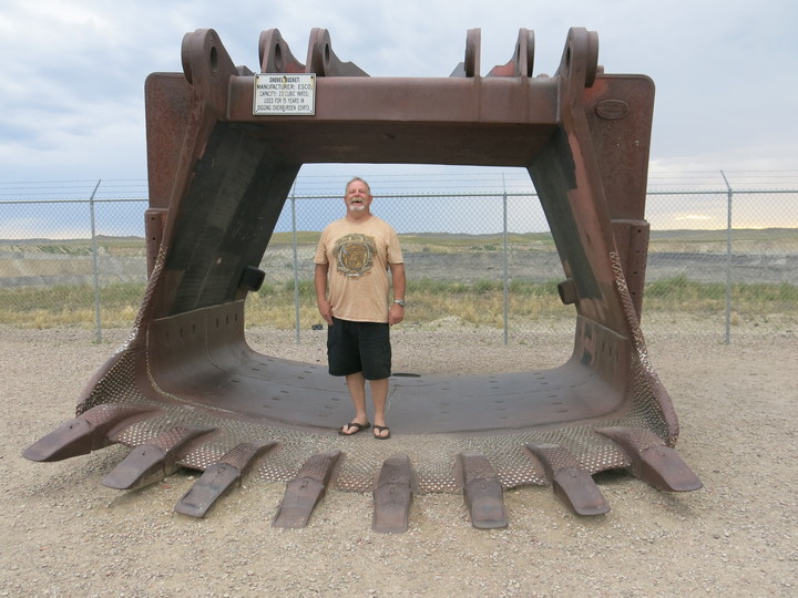 Miner Kent Parrish stands in a coal shovel at a roadside viewing platform for the Eagle Butte coal mine outside of Gillette, Wyoming. Photo: Leigh Paterson / Inside Energy