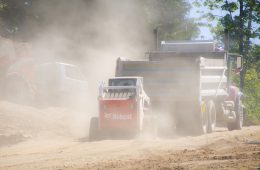truck spreading liquid to suppress dust