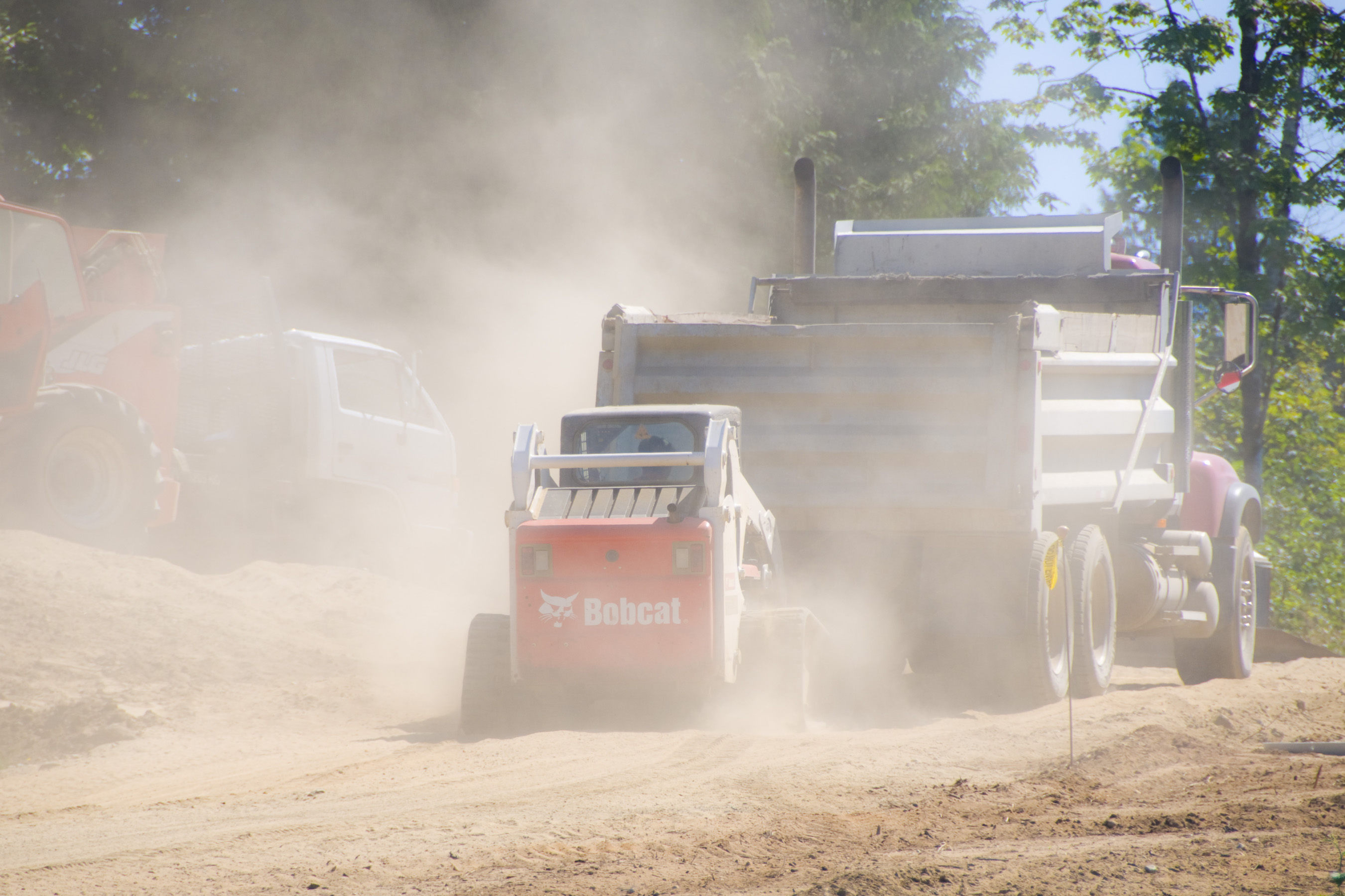 truck spreading liquid to suppress dust