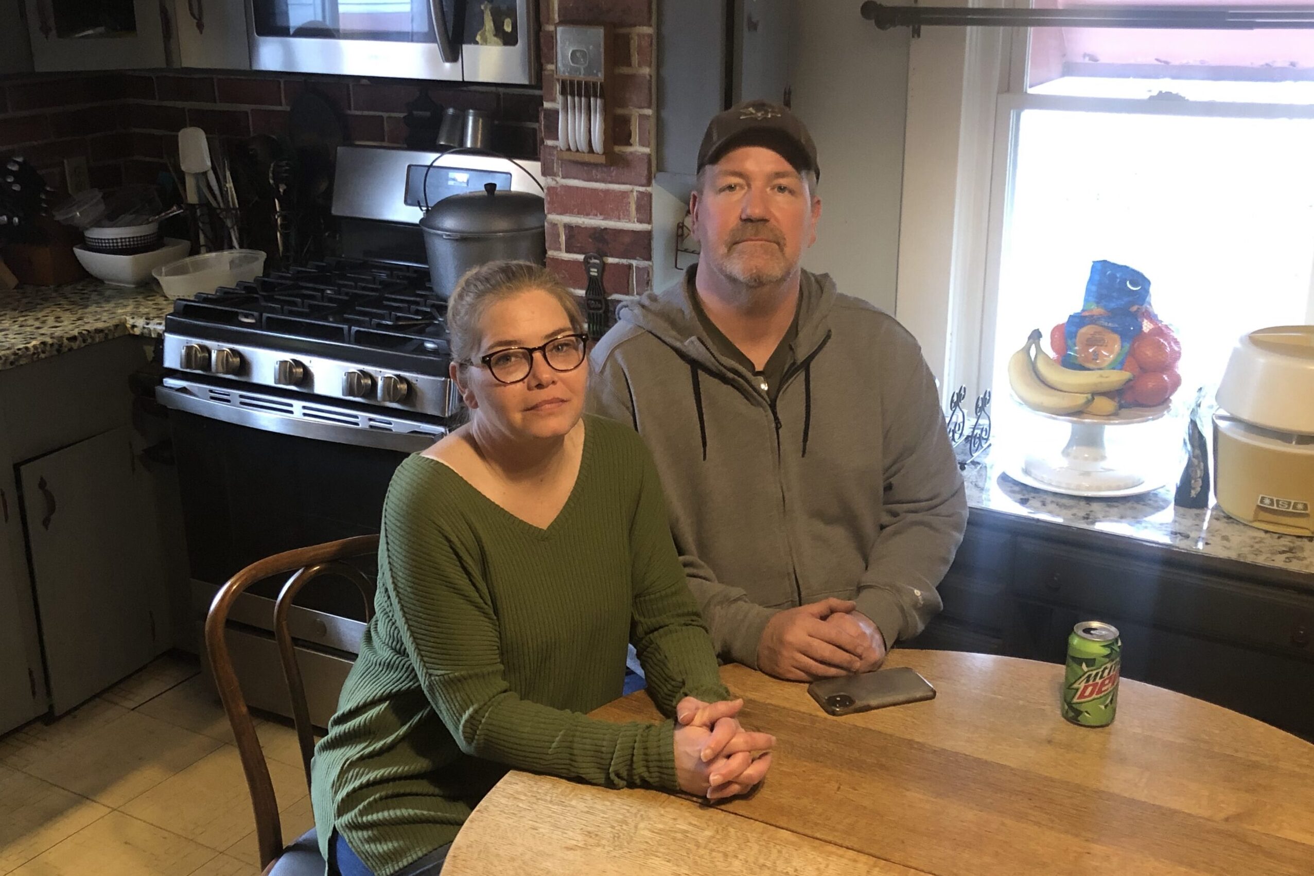 Tamara and Nelson Freeze sitting at a kitchen table