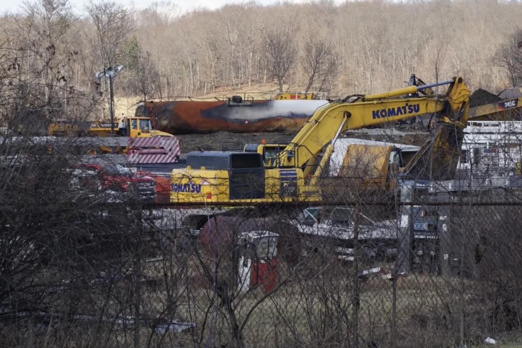 Construction equipment behind a fence