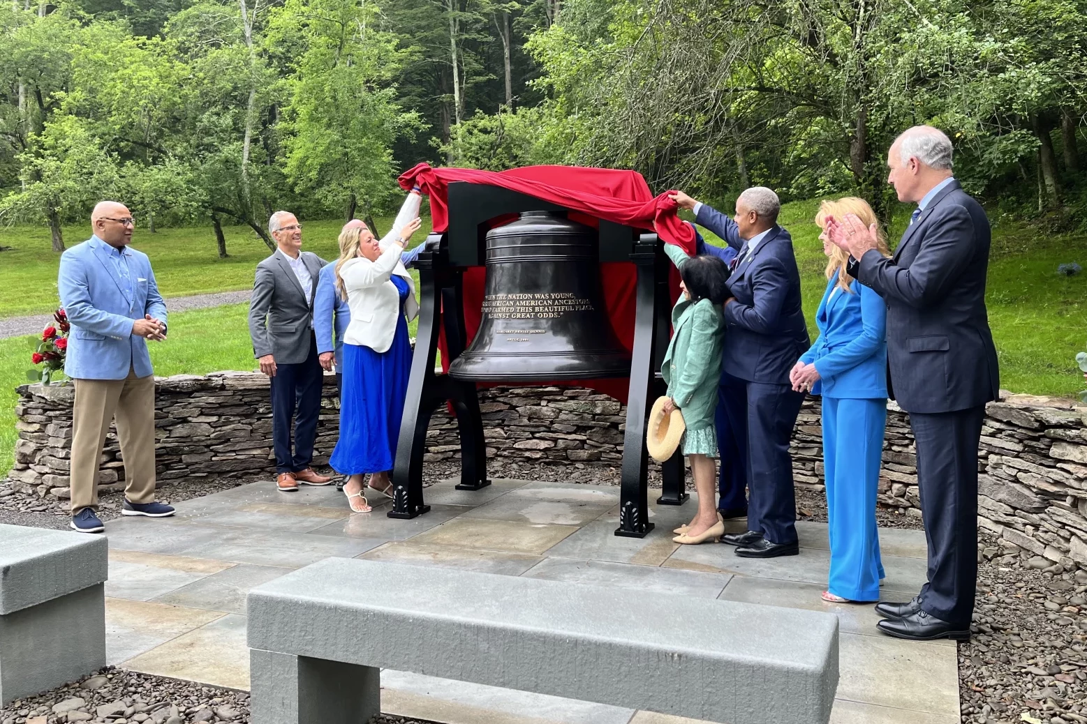 Group around an bronze bell