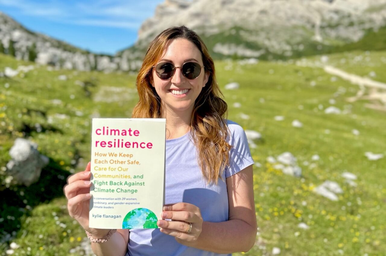Kylie Flanagan holding her book