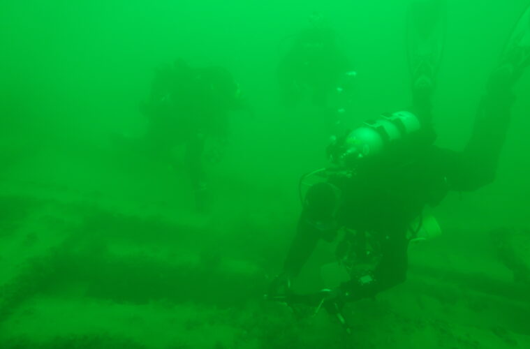 Divers at a shipwreck