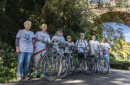 bike riders stand with their bikes