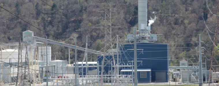 An industrial building behind transmission wires