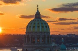 The sun rises over the state Capitol building in Harrisburg, Pennsylvania.