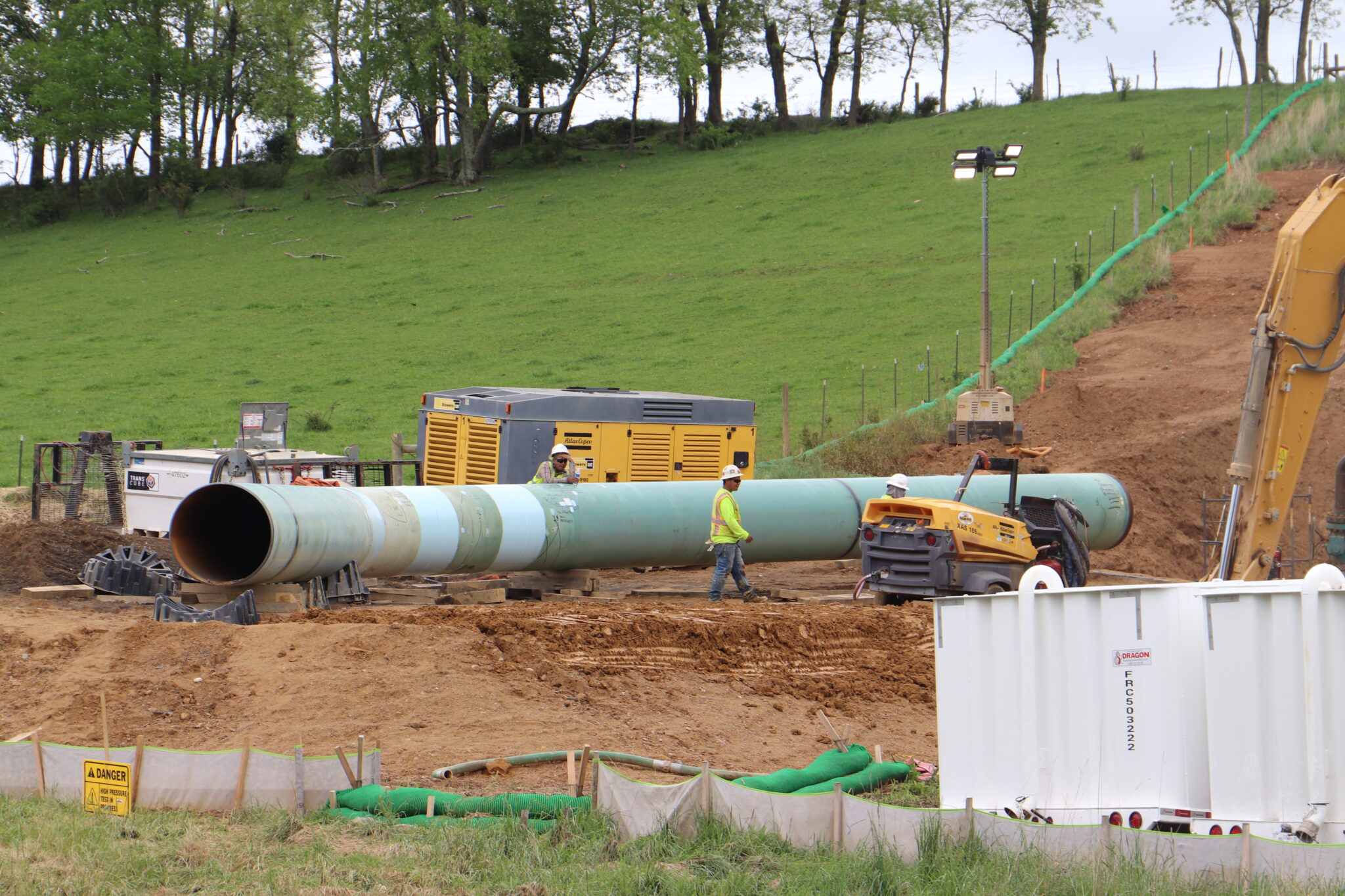 A pipeline sits at a construction site.