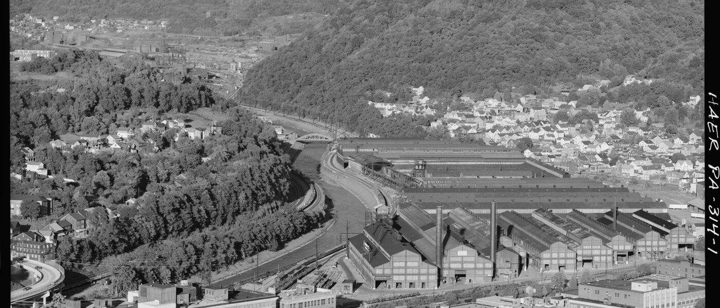 A black and white image of an aerial view of an iron plant