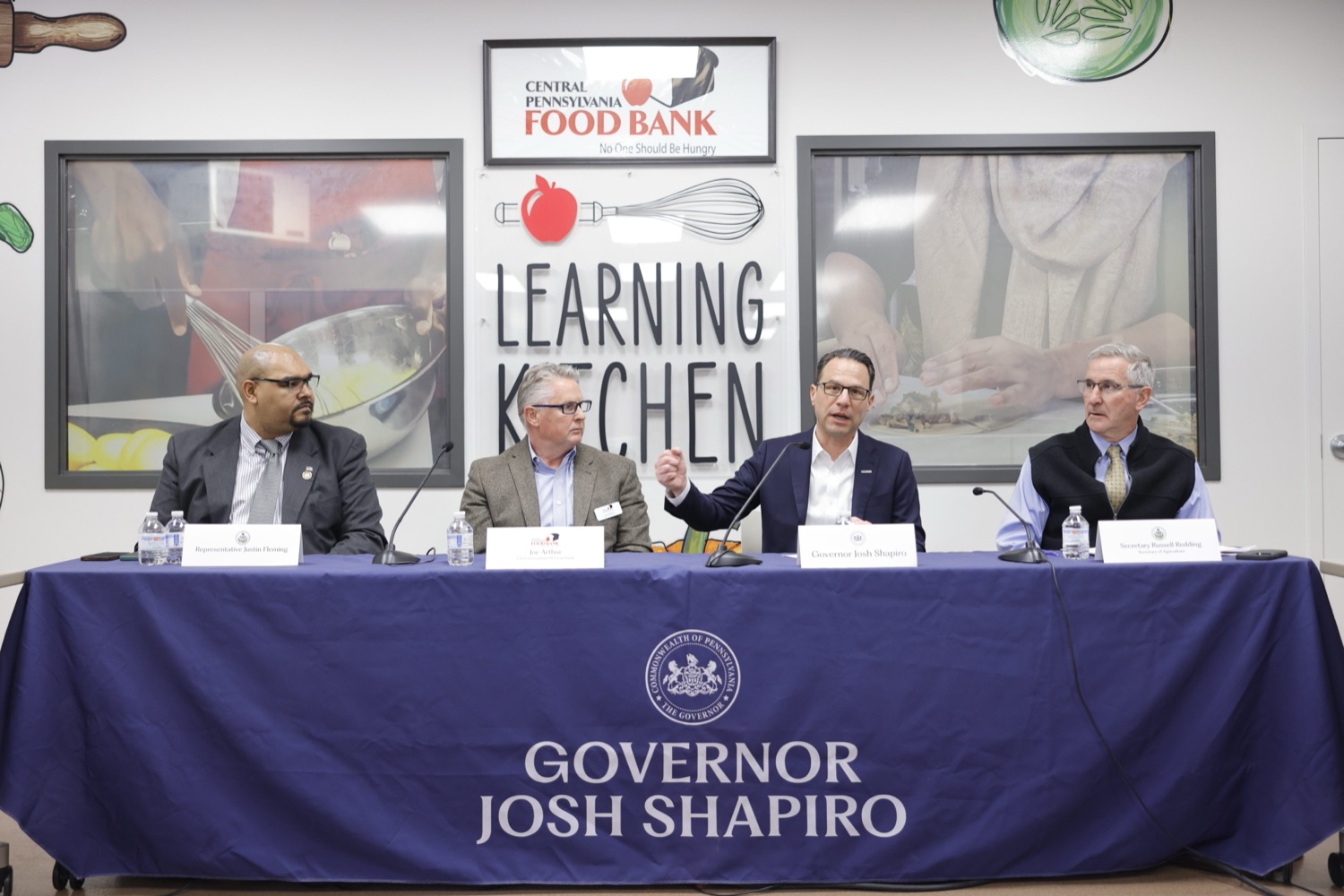Governor Shapiro with our other men at a table