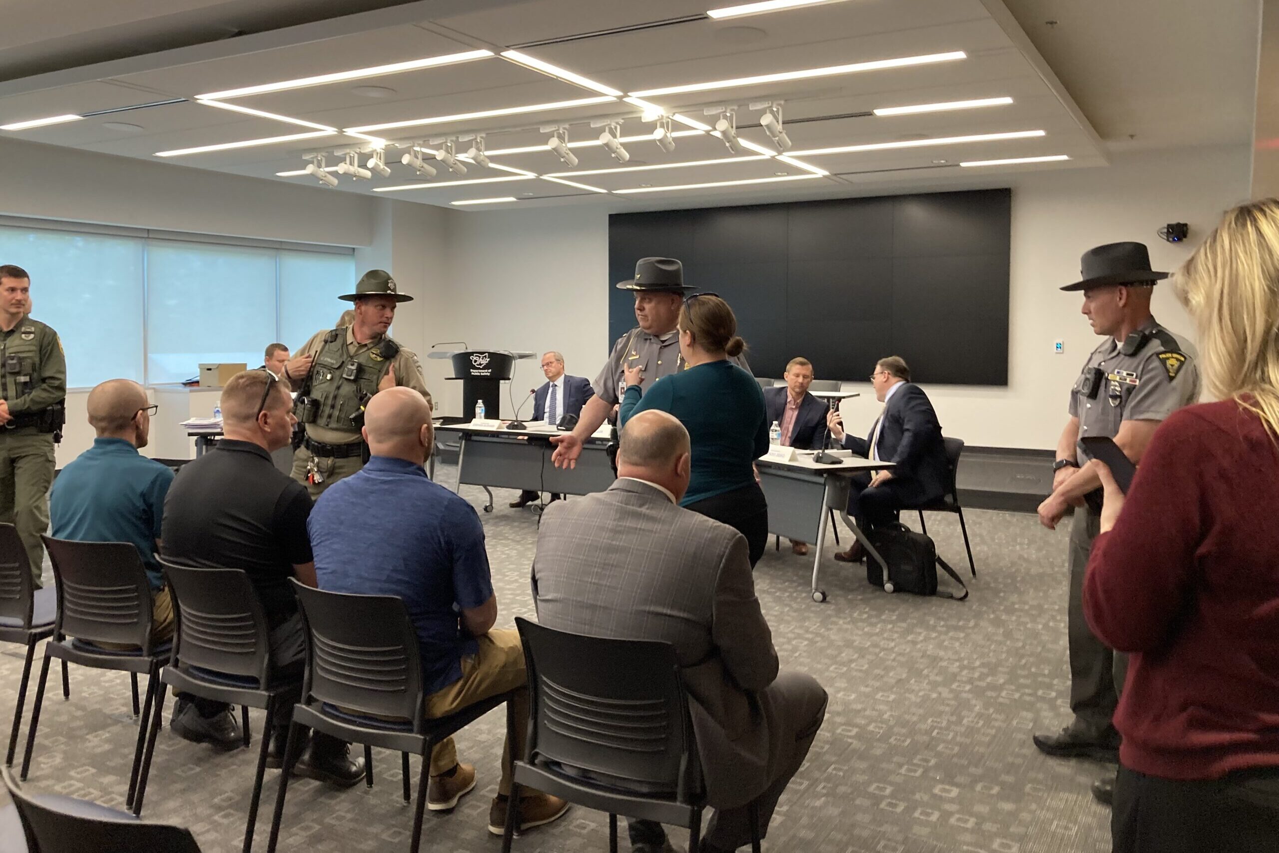 A meeting with four police officers in front
